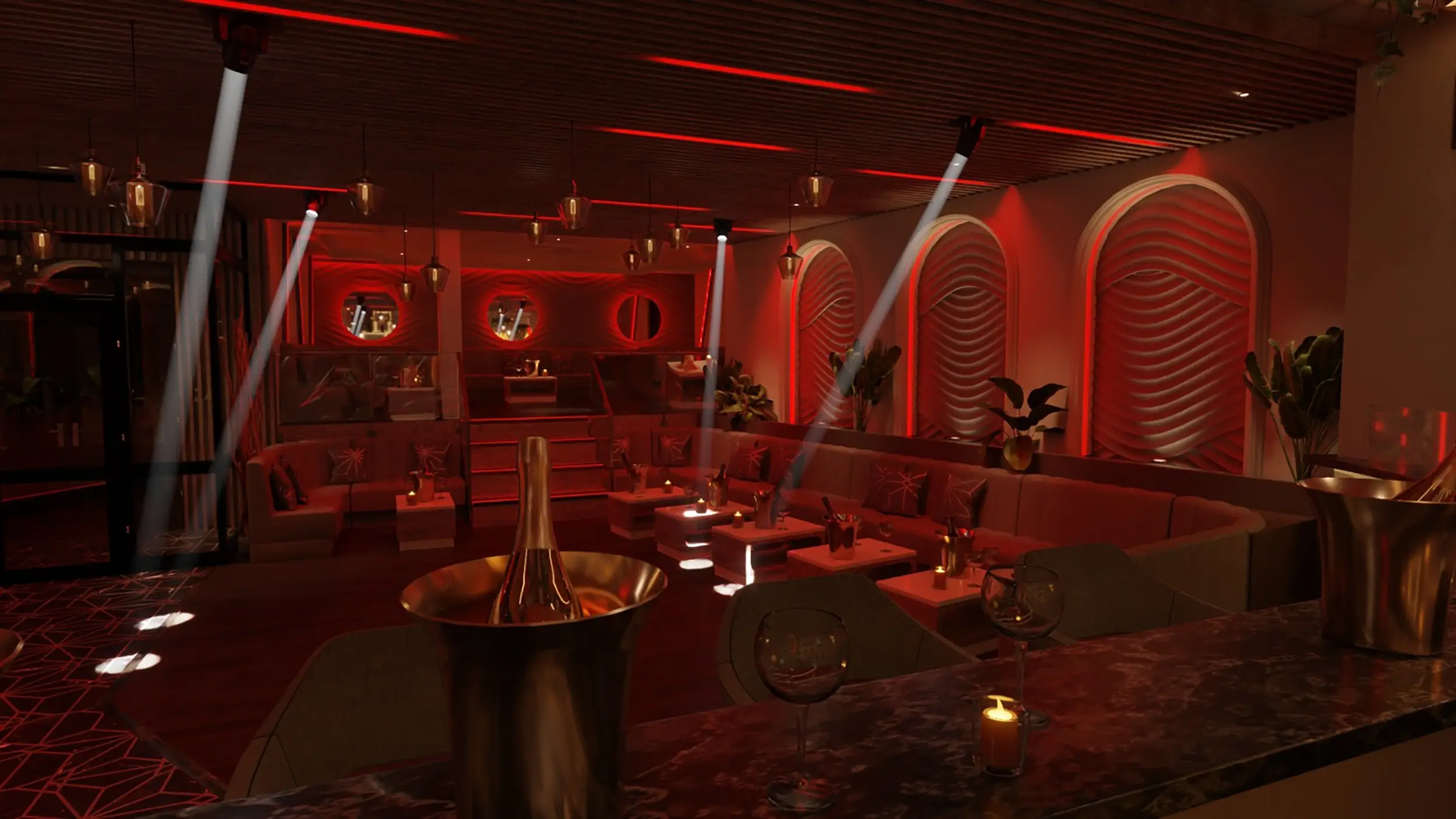 Salle avec des lumières rouges de l'Estival. C'est un restaurant et bar en Seine-Maritime aménagé en son et lumière par le Groupe Silam.
